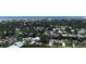A residential neighborhood aerial view showcasing the homes with tree coverage and proximity to the city at 426 Bouchelle Dr # 401, New Smyrna Beach, FL 32169