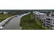 A stunning aerial view of a riverside community with docks, lush greenery, and waterway access at 426 Bouchelle Dr # 401, New Smyrna Beach, FL 32169