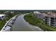 A beautiful aerial view of a waterfront condo community with private docks along the river at 426 Bouchelle Dr # 401, New Smyrna Beach, FL 32169
