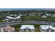 Stunning aerial view of a waterfront property with boat docks and beautiful coastal scenery at 426 Bouchelle Dr # 401, New Smyrna Beach, FL 32169
