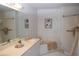 Bathroom view featuring a large mirror, vanity, and tub with shower, creating a spa-like experience at 426 Bouchelle Dr # 401, New Smyrna Beach, FL 32169
