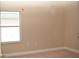 Cozy bedroom with a window, carpeted floors, and simple design, providing a relaxing atmosphere at 426 Bouchelle Dr # 401, New Smyrna Beach, FL 32169
