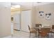 Dining area with a glass-top table and rattan chairs at 426 Bouchelle Dr # 401, New Smyrna Beach, FL 32169