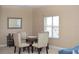 Cozy dining space featuring a glass table, comfortable seating, and natural lighting at 426 Bouchelle Dr # 401, New Smyrna Beach, FL 32169