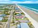 Aerial view of the property outlined in yellow with beach proximity at 4323 S Atlantic Ave, Port Orange, FL 32127