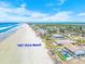 Breathtaking aerial view of the property, showcasing its prime beachfront location at 4323 S Atlantic Ave, Port Orange, FL 32127