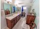 The bathroom offers a double sink vanity, dressing table, and a walk-in closet at 4323 S Atlantic Ave, Port Orange, FL 32127