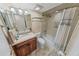 Tiled bathroom with vanity sink, toilet and shower with white shower curtain at 4323 S Atlantic Ave, Port Orange, FL 32127