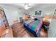 Bedroom with fan, desk and shelves at 4323 S Atlantic Ave, Port Orange, FL 32127