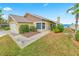 Charming single-story home with lush landscaping and a glimpse of the ocean in the background at 4323 S Atlantic Ave, Port Orange, FL 32127
