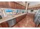 A well-equipped kitchen featuring wood cabinets and expansive countertops, with ocean views at 4323 S Atlantic Ave, Port Orange, FL 32127