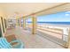 Enclosed lanai featuring tile flooring and breathtaking ocean views, perfect for relaxing and entertaining at 4323 S Atlantic Ave, Port Orange, FL 32127