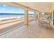 Screened in Lanai providing stunning ocean views, perfect for dining and relaxation with indoor-outdoor living at 4323 S Atlantic Ave, Port Orange, FL 32127