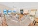 Bright living room features tile floors, a cozy fireplace, and stunning ocean views through expansive windows at 4323 S Atlantic Ave, Port Orange, FL 32127