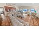 Spacious living room with tile floors, comfortable seating, and panoramic ocean views through sliding glass doors at 4323 S Atlantic Ave, Port Orange, FL 32127