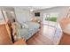 The main bedroom features wood floors and a sliding glass door for outdoor access at 4323 S Atlantic Ave, Port Orange, FL 32127