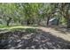 Spacious backyard with mature trees providing ample shade and privacy at 4580 Lake James Cir, Edgewater, FL 32141