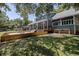 Beautiful home exterior surrounded by lush landscaping and a spacious backyard with mature trees at 4580 Lake James Cir, Edgewater, FL 32141