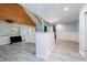 Open bonus room with vaulted ceilings, gray wood-look floors, and access to the exterior at 4580 Lake James Cir, Edgewater, FL 32141