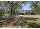 Charming single-story home with a well-maintained lawn and mature trees at 4580 Lake James Cir, Edgewater, FL 32141