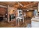 Rustic kitchen featuring wooden ceilings, brick accents, and a mix of vintage and modern appliances at 4580 Lake James Cir, Edgewater, FL 32141