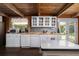 Bright kitchen with white cabinetry and stainless steel appliances, providing a clean and modern cooking space at 4580 Lake James Cir, Edgewater, FL 32141