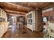 Spacious kitchen with exposed beams, brick elements, and an open layout, great for cooking and entertaining at 4580 Lake James Cir, Edgewater, FL 32141