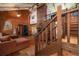 Inviting living room with wood-paneled walls and a staircase, creating a warm and welcoming atmosphere at 4580 Lake James Cir, Edgewater, FL 32141