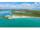 Aerial view of the inlet with beach, lighthouse, community and intercoastal waterway at 4670 Links Village Dr # D206, Ponce Inlet, FL 32127