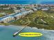 An aerial view of the marina, condo complex and fishing pier in Harbour Village at 4670 Links Village Dr # D206, Ponce Inlet, FL 32127