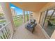 Open balcony overlooking the beautifully maintained landscape and nearby building at 4670 Links Village Dr # D206, Ponce Inlet, FL 32127