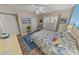 Bedroom with coastal accents and beach themed decor at 4670 Links Village Dr # D206, Ponce Inlet, FL 32127