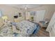 Bedroom with coastal accents, closet, wood-look flooring, and neutral walls at 4670 Links Village Dr # D206, Ponce Inlet, FL 32127