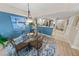 Inviting dining area with modern chandelier, seating four, and open to the kitchen at 4670 Links Village Dr # D206, Ponce Inlet, FL 32127