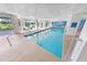 Bright indoor pool area with clear pool and ample windows, perfect for year-round enjoyment at 4670 Links Village Dr # D206, Ponce Inlet, FL 32127