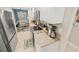Updated kitchen with stainless steel appliances, stylish backsplash, and ample counter space at 4670 Links Village Dr # D206, Ponce Inlet, FL 32127