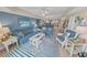 Bright living room boasts modern coastal furnishings and open concept living space at 4670 Links Village Dr # D206, Ponce Inlet, FL 32127