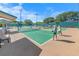 Active pickleball courts in a vibrant community, offering recreational opportunities with well-maintained facilities and shaded seating areas at 4670 Links Village Dr # D206, Ponce Inlet, FL 32127