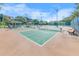 Well-maintained pickleball courts in a lively community setting, featuring ample seating, shaded areas, and recreational amenities at 4670 Links Village Dr # D206, Ponce Inlet, FL 32127