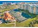 Aerial view of well-maintained tennis courts at a Harbour Village condo complex near the beach at 4670 Links Village Dr # D206, Ponce Inlet, FL 32127