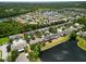 Aerial shot of the community showcasing a lake and beautiful homes nestled among lush greenery at 567 Mount Olympus Blvd, New Smyrna Beach, FL 32168