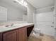Bathroom featuring a vanity with a sink, a large mirror, and a combined tub and shower at 567 Mount Olympus Blvd, New Smyrna Beach, FL 32168