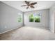 Bedroom featuring neutral walls, carpet, and ceiling fan at 567 Mount Olympus Blvd, New Smyrna Beach, FL 32168