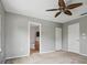 Bedroom featuring neutral walls, carpet, a ceiling fan, and a closet at 567 Mount Olympus Blvd, New Smyrna Beach, FL 32168