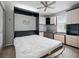 Bright bedroom featuring a built-in Murphy bed, ceiling fan, and lots of storage at 567 Mount Olympus Blvd, New Smyrna Beach, FL 32168