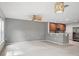 This open concept living room features tile flooring and access to the kitchen at 567 Mount Olympus Blvd, New Smyrna Beach, FL 32168