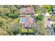 An aerial view of the property features a pool and a well-manicured lawn at 6088 Sabal Hammock Cir, Port Orange, FL 32128