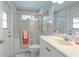 Bathroom featuring a glass-enclosed shower and single sink vanity at 6088 Sabal Hammock Cir, Port Orange, FL 32128