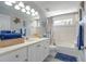 Bathroom with a single sink vanity and bathtub-shower combo, decorated with nautical accents at 6088 Sabal Hammock Cir, Port Orange, FL 32128