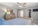 Bedroom with soft gray walls, plush carpet, and a well-organized closet space at 6088 Sabal Hammock Cir, Port Orange, FL 32128